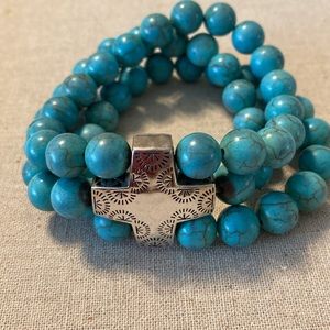 Turquoise and silver three strand stretch bracelet. A stunning gift!